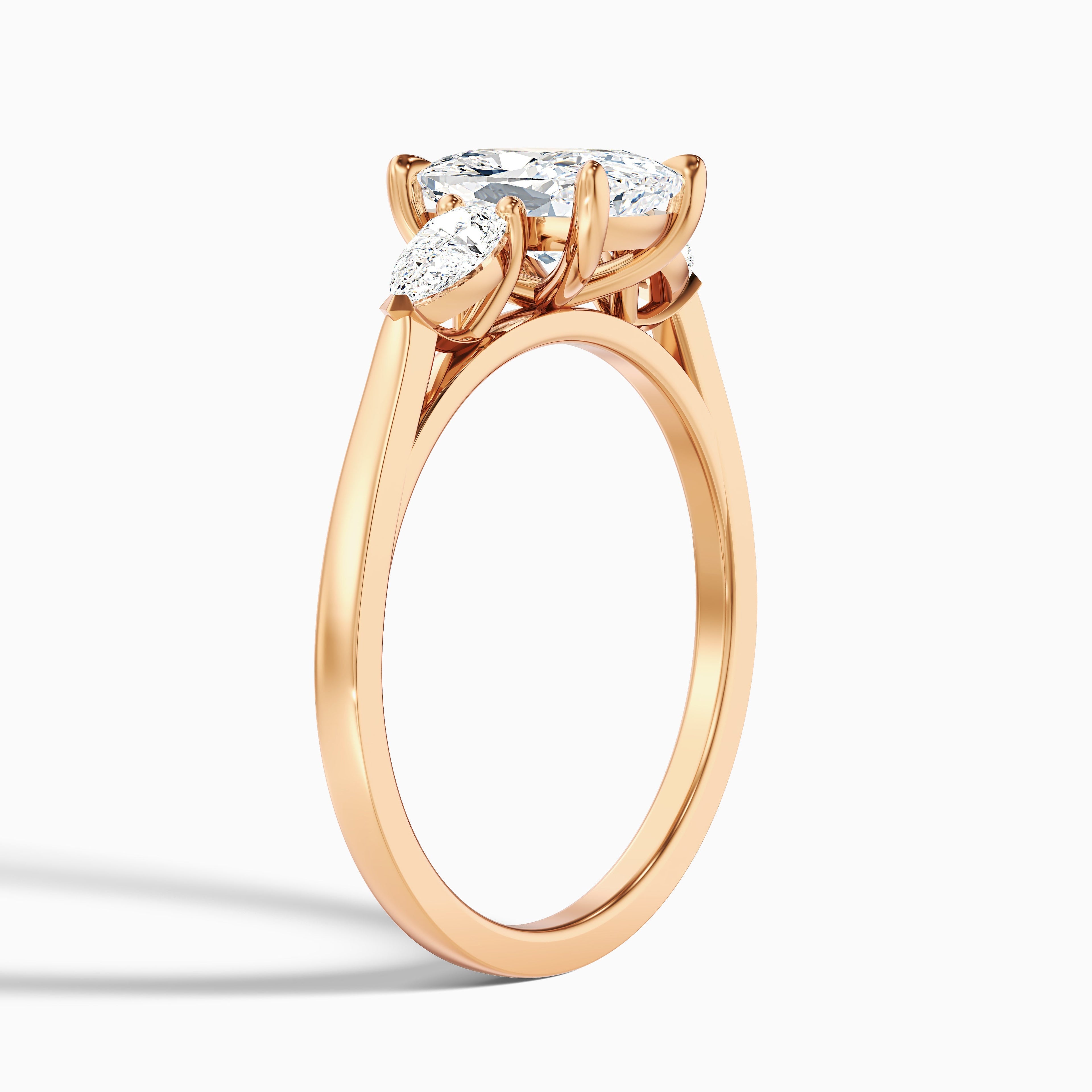 Haley 4.5 Carat Three Stone Ring with Pear Side Stones and an Elongated Cushion Moissanite Diamond in 10k Yellow Gold