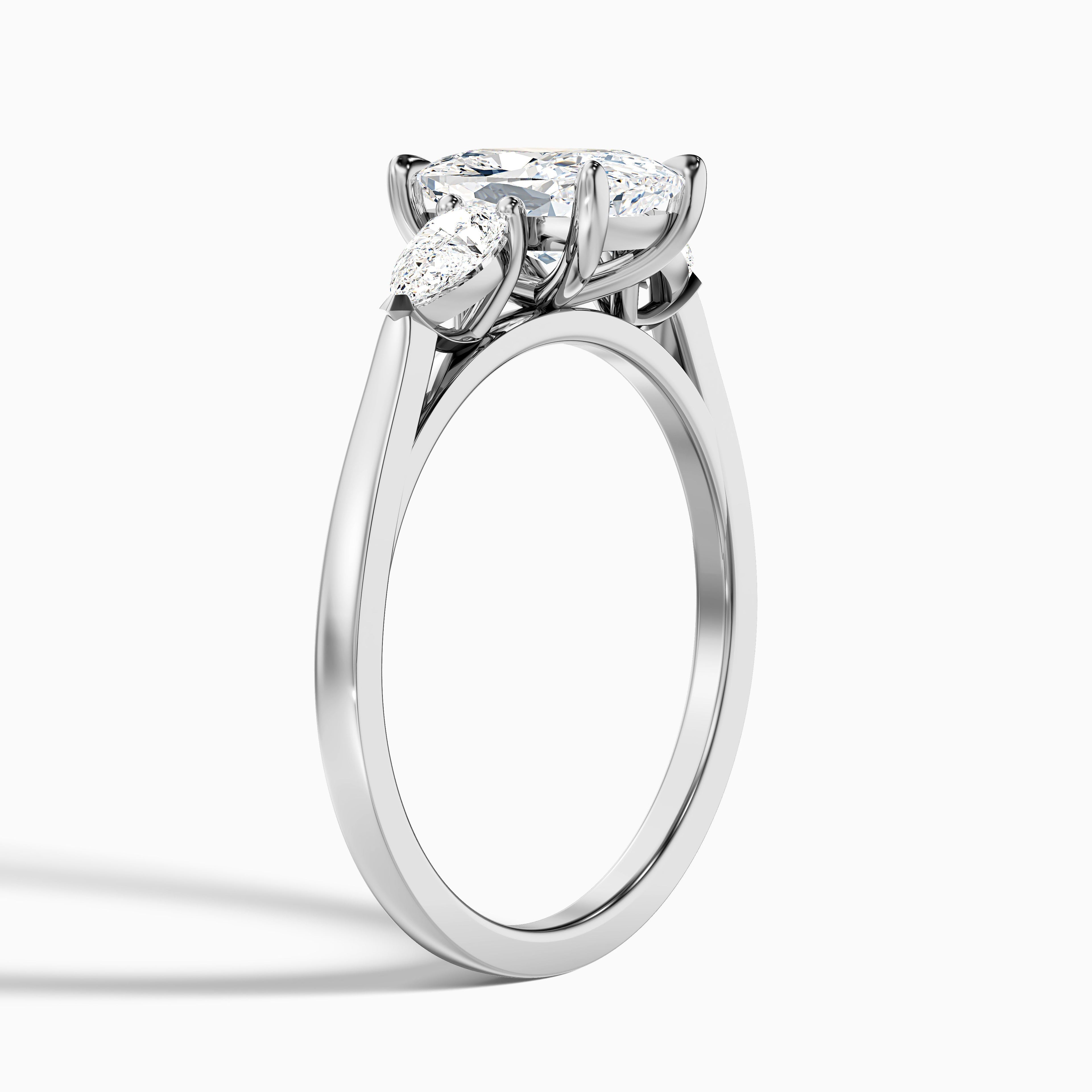 Haley 1.5 Carat Three Stone Ring with Pear Side Stones and an Elongated Cushion Lab Grown Diamond in 14k Yellow Gold