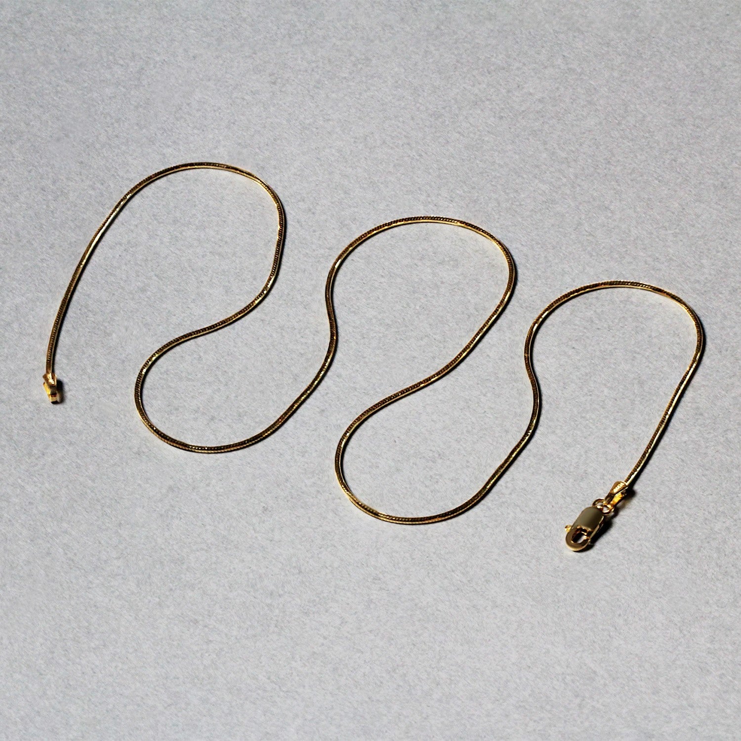 14k Yellow Gold Round Snake Chain 0.9mm by Bids.com