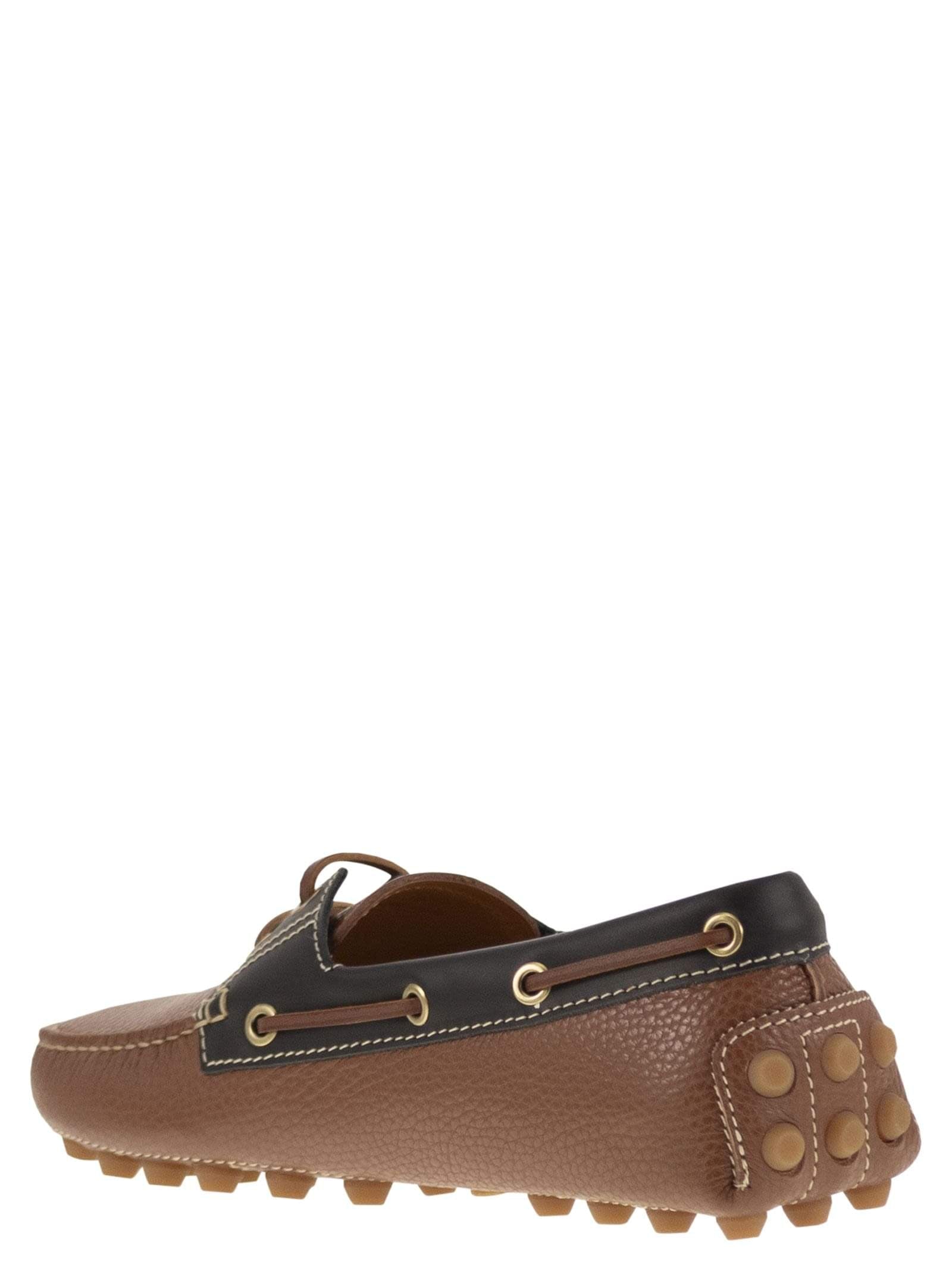 Tods women leather boat bubble grommet