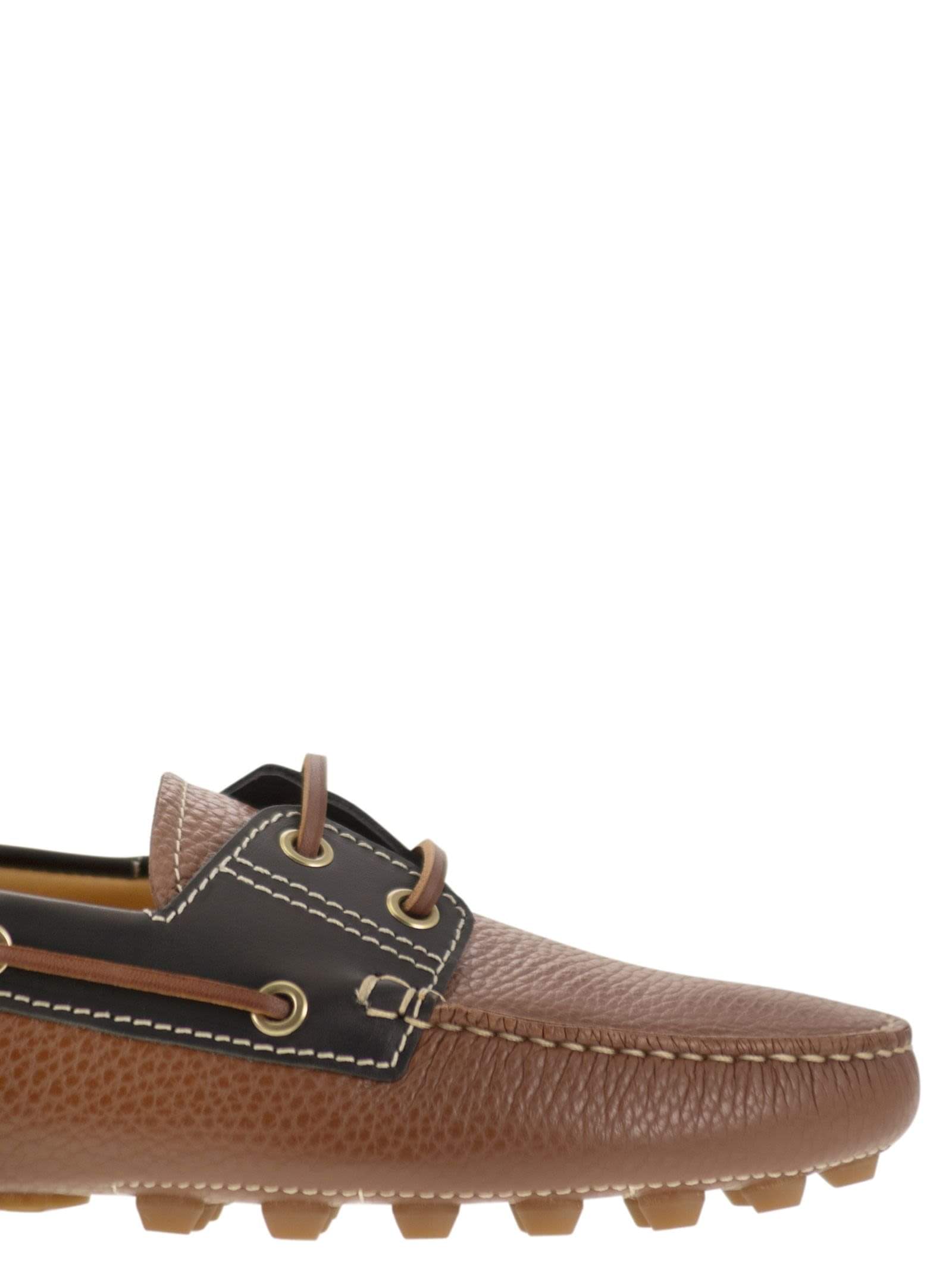Tods women leather boat bubble grommet