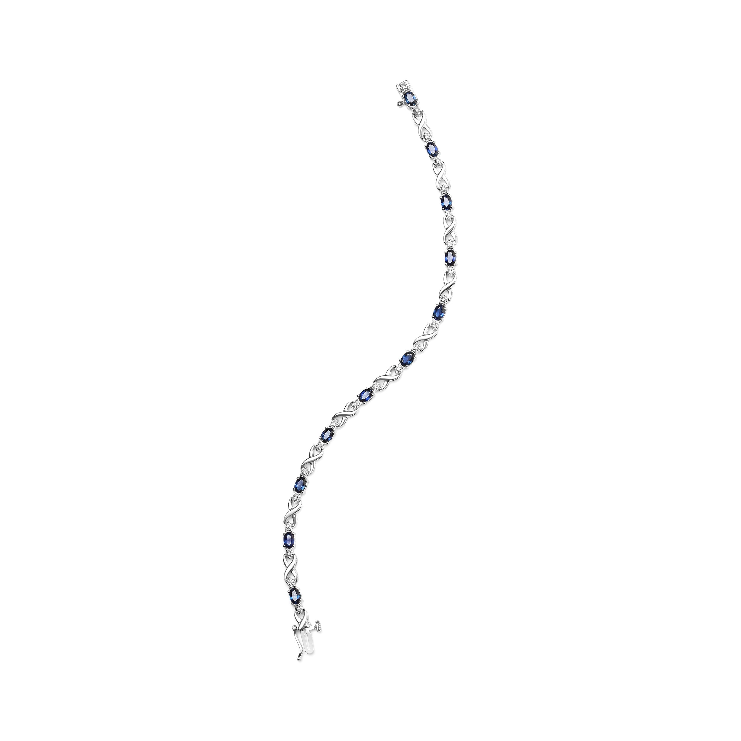 10K White Gold 5x4mm Oval Sapphire Gemstone and 1/10 Cttw Diamond Prong Set "X" Link Bracelet - Size 7" (H-I Color, SI1-SI2 Clarity) DestGlow