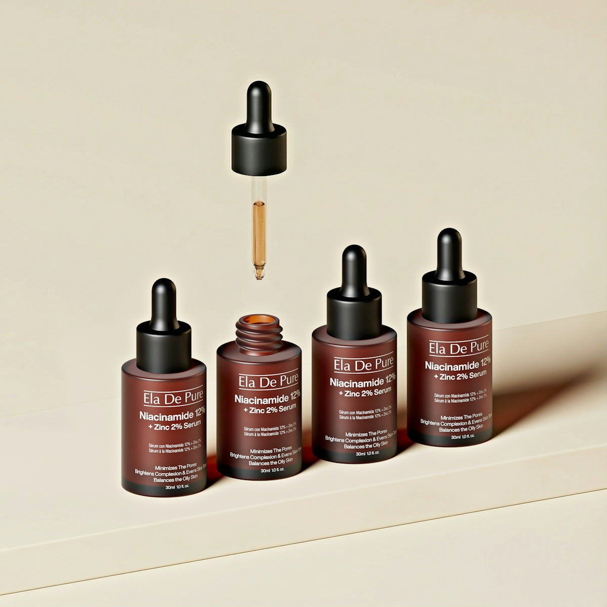 Four small bottles of serum with droppers