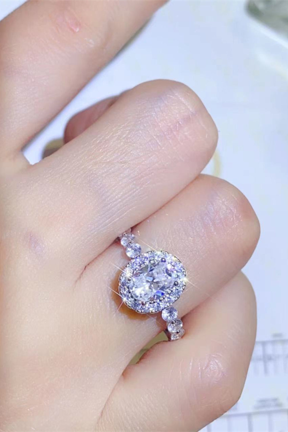 Adored 1 Carat Oval-Cut Sparkala™ Platinum Over Pure Sterling Silver Halo Ring by Sparkala