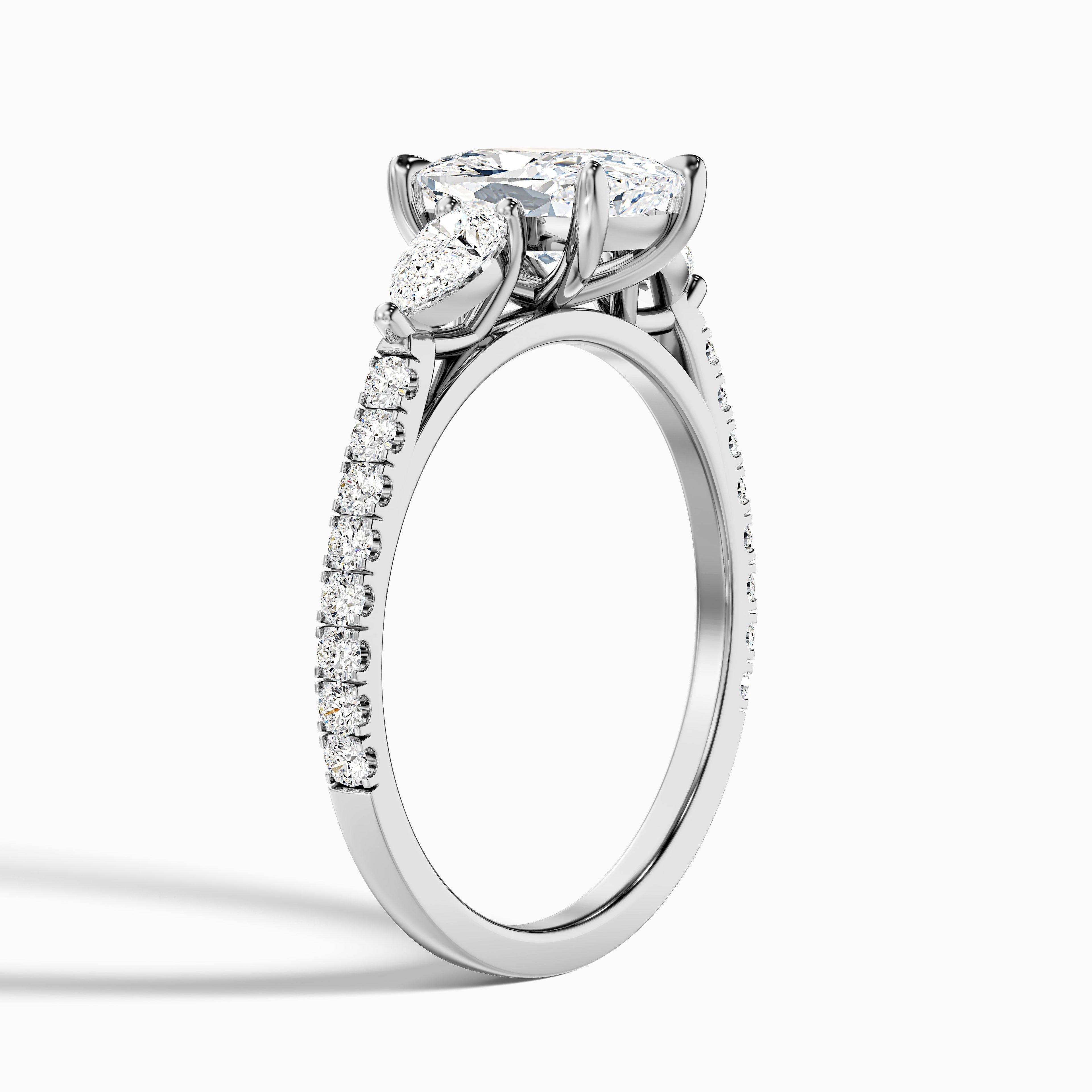 Ivana 2.5 Carat Three Stone Pave Ring with Pear Side Stones and an Elongated Cushion Moissanite Diamond in 10k Yellow Gold