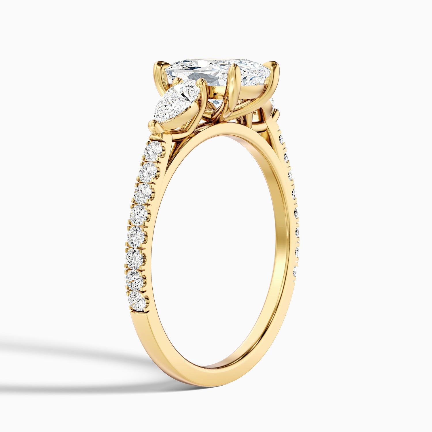 Ivana 1.5 Carat Three Stone Pave Ring with Pear Side Stones and an Elongated Cushion Moissanite Diamond in 14k Yellow Gold
