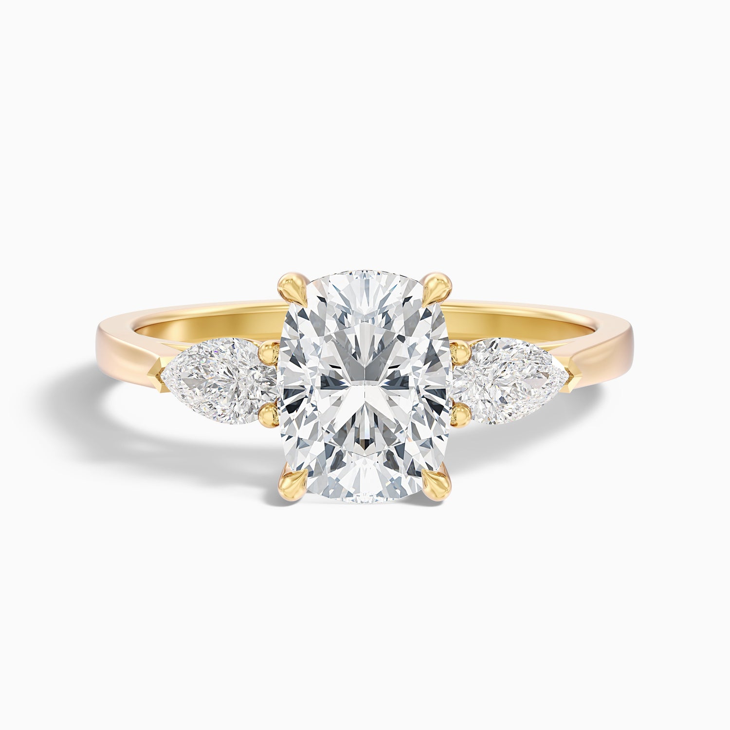 Haley 4.5 Carat Three Stone Ring with Pear Side Stones and an Elongated Cushion Moissanite Diamond in 18k Yellow Gold