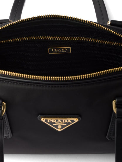 Prada Women Re-Nylon And Leather Medium Top-Handle Bag With Padlock by Luosophy