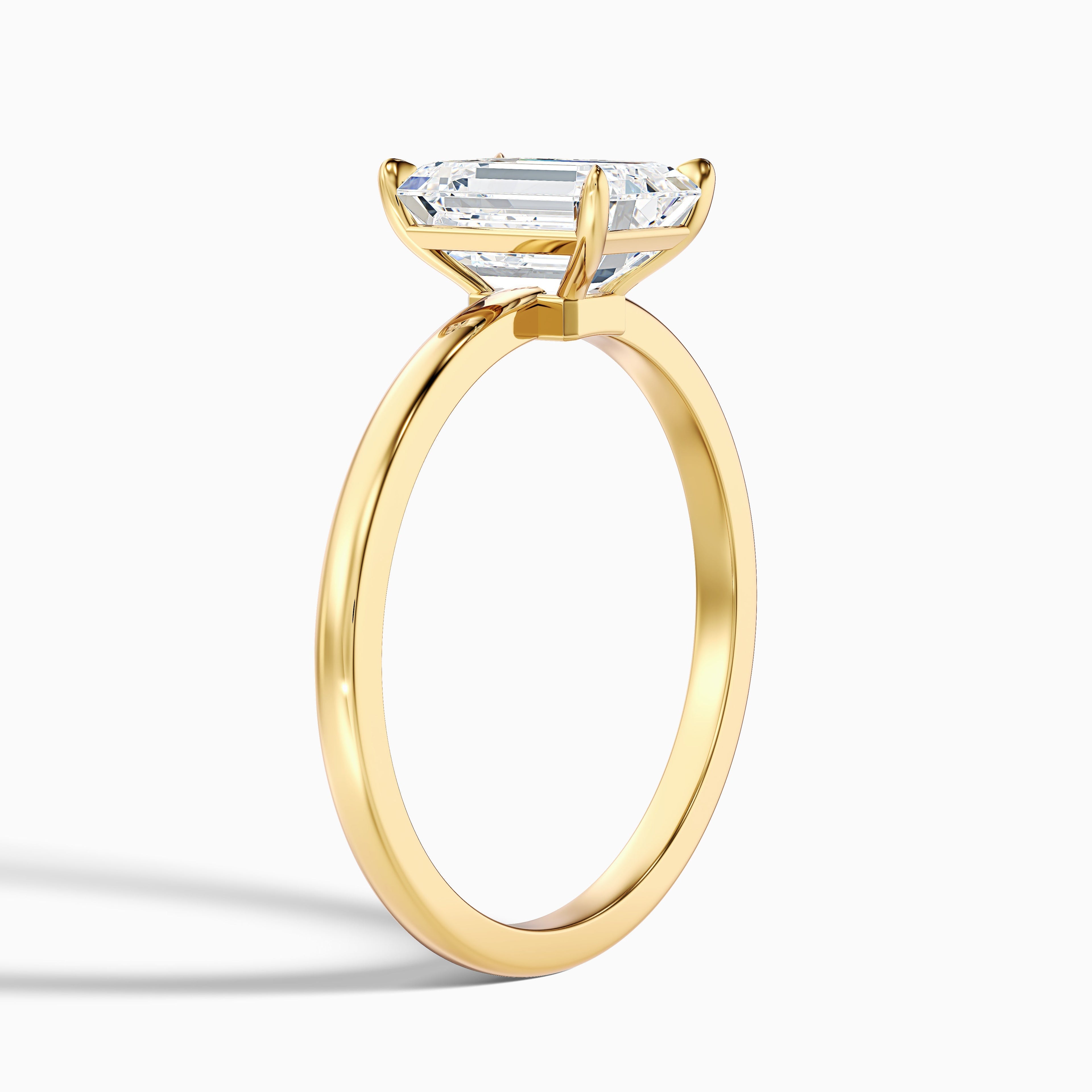 Andie 3 Carat Emerald Cut Low Profile Solitaire Moissanite Diamond Ring in 10k White Gold