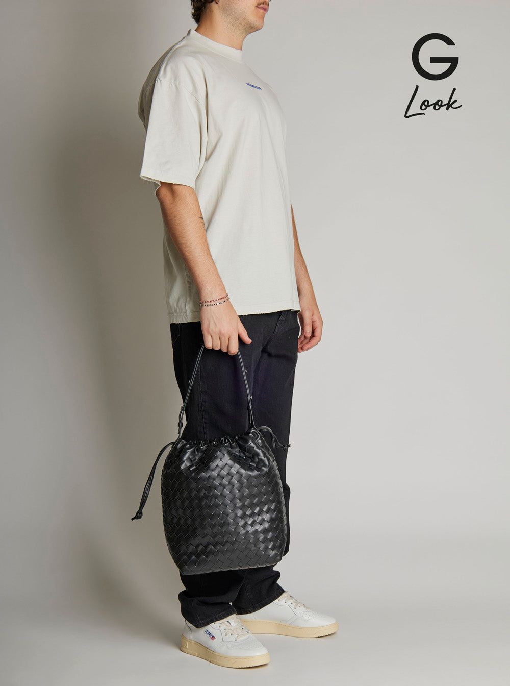 Bottega Veneta Men Black Shoulder Bag With Drawstring Closure And Intrecciato Motif In Leather Man by Luosophy