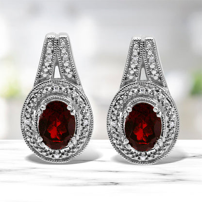 .925 Sterling Silver Diamond Accent and 8x6mm Red Oval Garnet Stud Earrings (I-J Color, I1-I2 Clarity) by Bids.com
