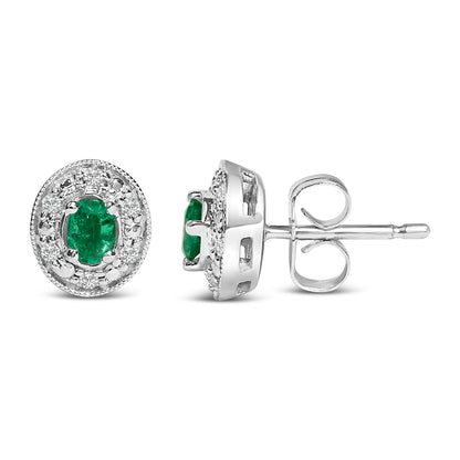 14K White Gold Oval Green Emerald and 1/10 Cttw Diamond Halo Stud Earrings (I-J Color, I1-I2 Clarity) by Bids.com