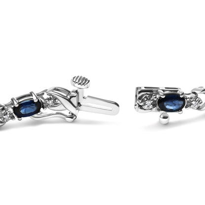 10K White Gold 5x4mm Oval Sapphire Gemstone and 1/10 Cttw Diamond Prong Set "X" Link Bracelet - Size 7" (H-I Color, SI1-SI2 Clarity) by Bids.com
