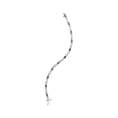 10K White Gold 5x4mm Oval Sapphire Gemstone and 1/10 Cttw Diamond Prong Set "X" Link Bracelet - Size 7" (H-I Color, SI1-SI2 Clarity) by Bids.com