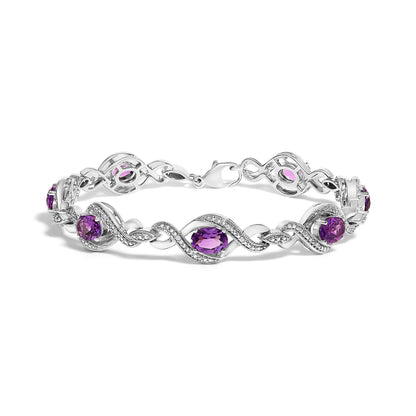 .925 Sterling Silver 1/10 Cttw Natural Round Diamond and 7X5MM Oval Amethyst Cross Tennis Bracelet (I-J Color, I1-I2 Clarity) - 7" by Bids.com