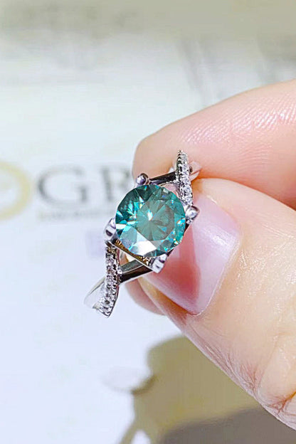 1 Carat Aqua Blue Brilliant Round Cut Sparkala™ Crisscross Platinum Over Pure Sterling Silver Ring - DestGlow