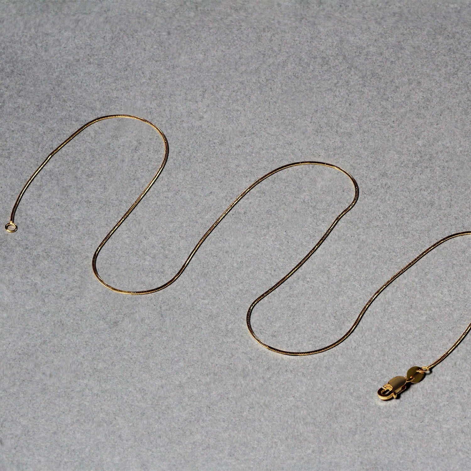 14k Yellow Gold Round Snake Chain 0.7mm by Bids.com
