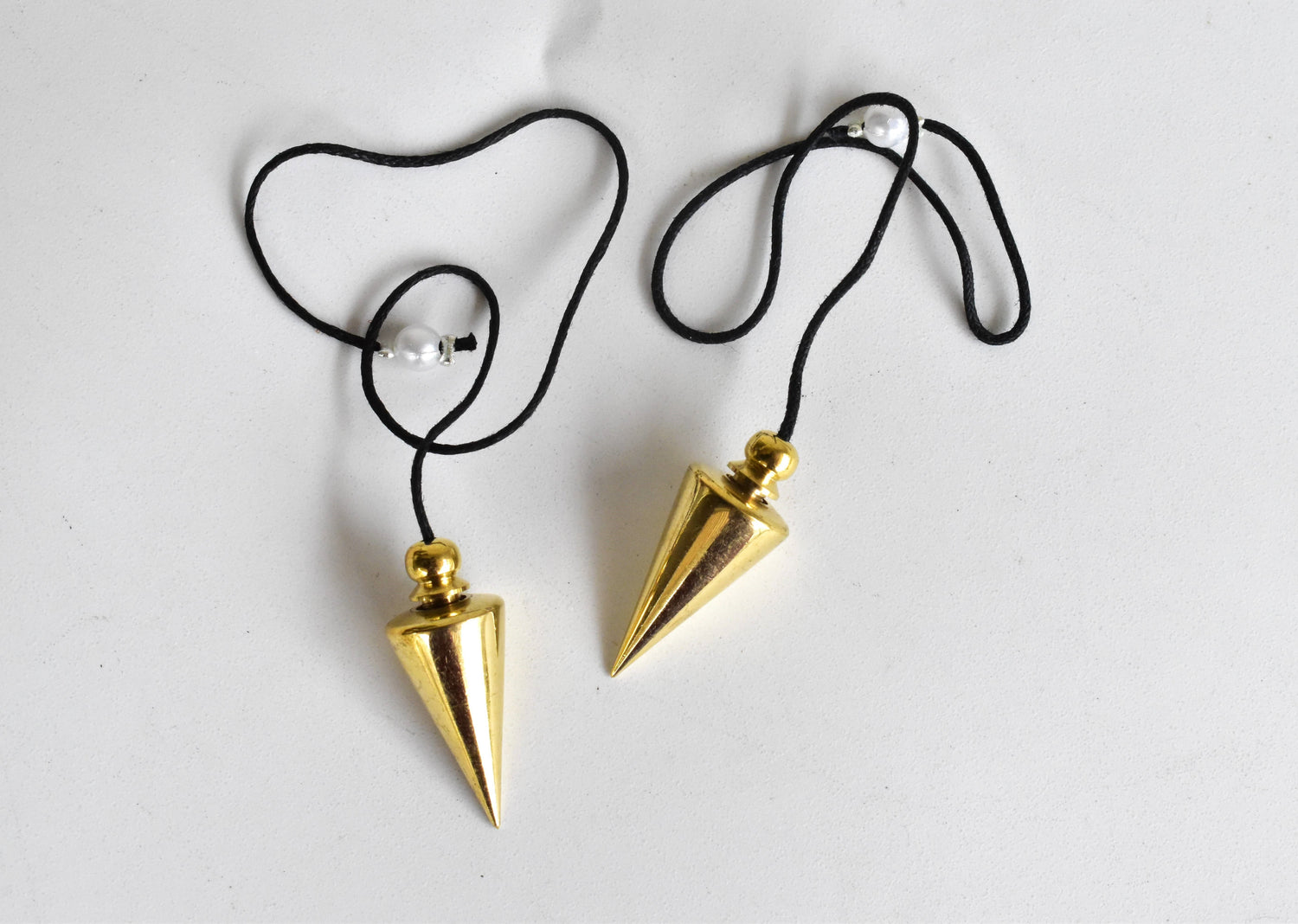 Cone with Round Brass Pendulum Silver Metal Pendulums.  DestGlow