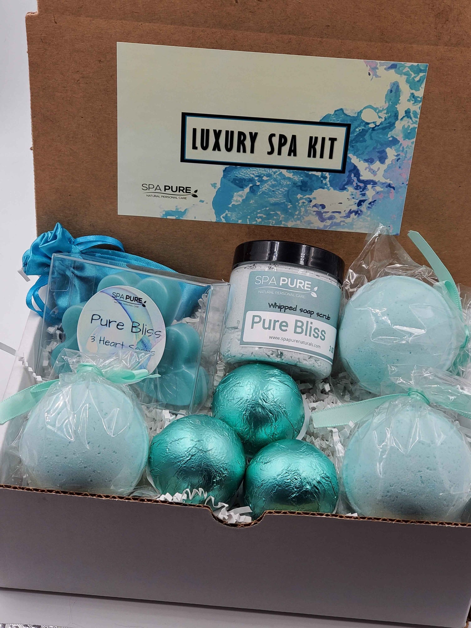 Spa Pure Luxury Spa Kit - Pure Bliss - 3 XL Pure Bliss Bath Fizzies, 3 Pure Bliss shower steamers, 3 Heart-shaped soaps, one 3.5 oz Pure Bliss whipped soap scrub, 1 Roll-on Perfume, Perfect for a mini-spa treatment.