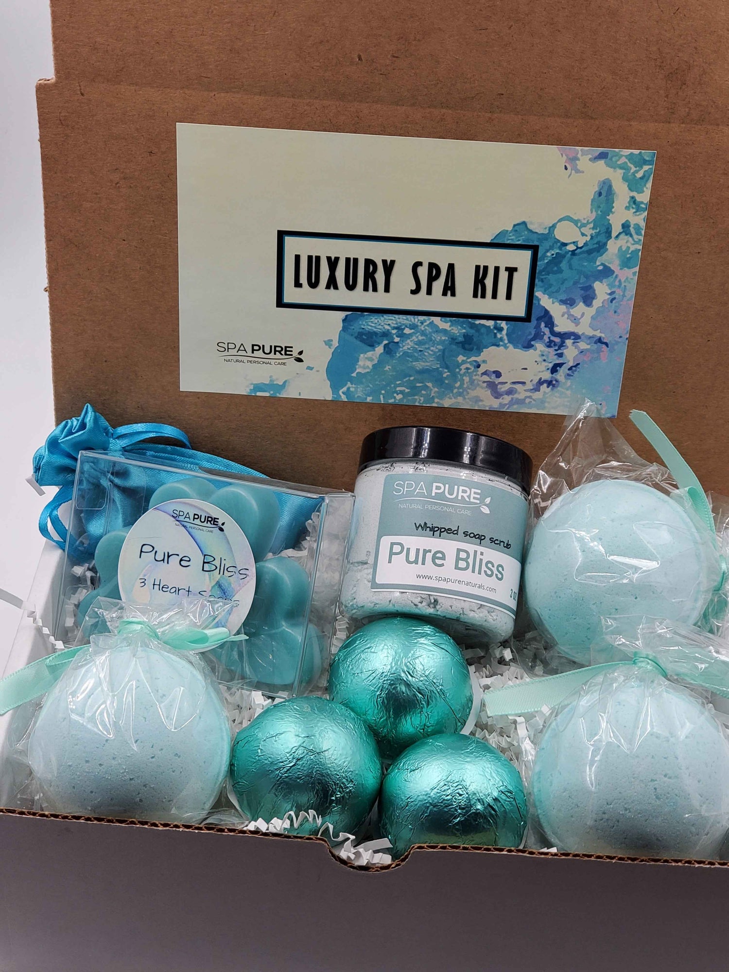 Spa Pure Luxury Spa Kit - Pure Bliss - 3 XL Pure Bliss Bath Fizzies, 3 Pure Bliss shower steamers, 3 Heart-shaped soaps, one 3.5 oz Pure Bliss whipped soap scrub, 1 Roll-on Perfume, Perfect for a mini-spa treatment.