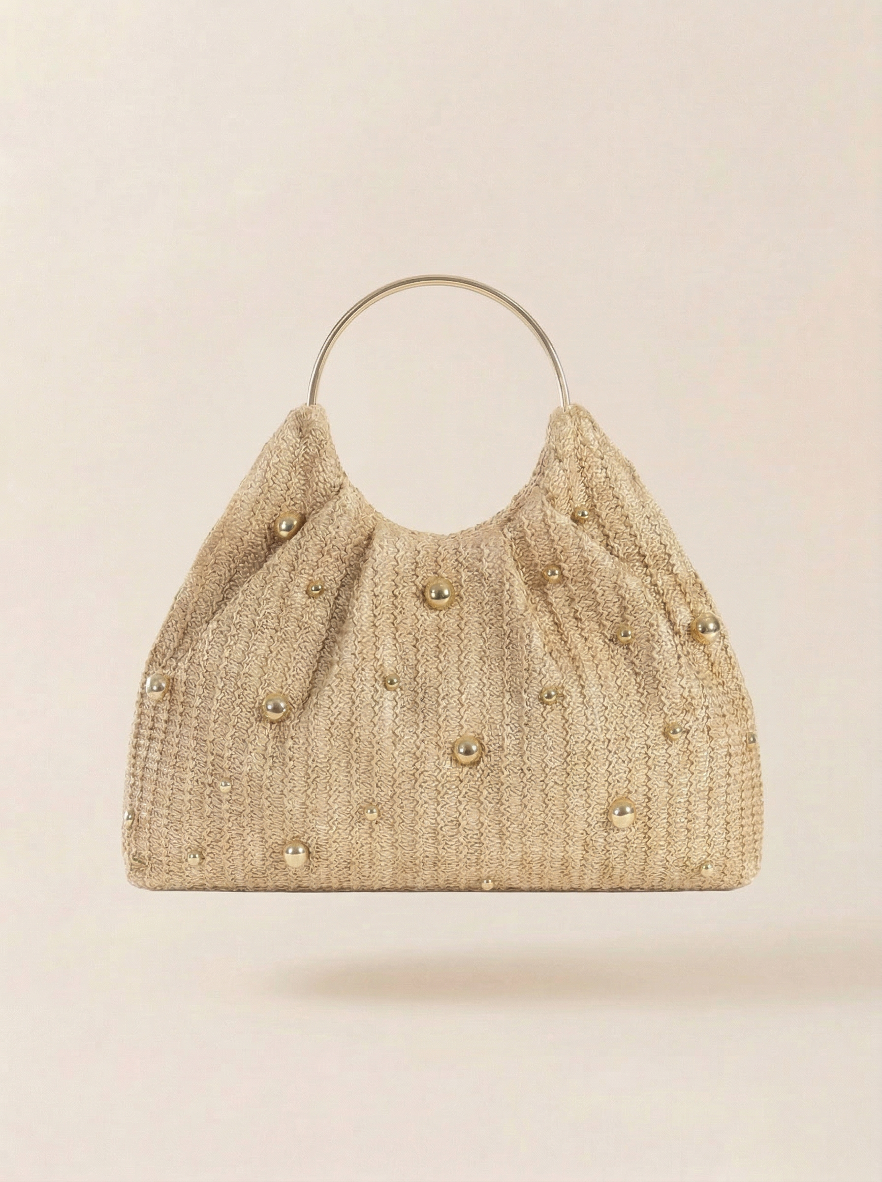 Artisanal Studded Handwoven Raffia Bag with Sculptural Gold Ring Handle by LINTICO