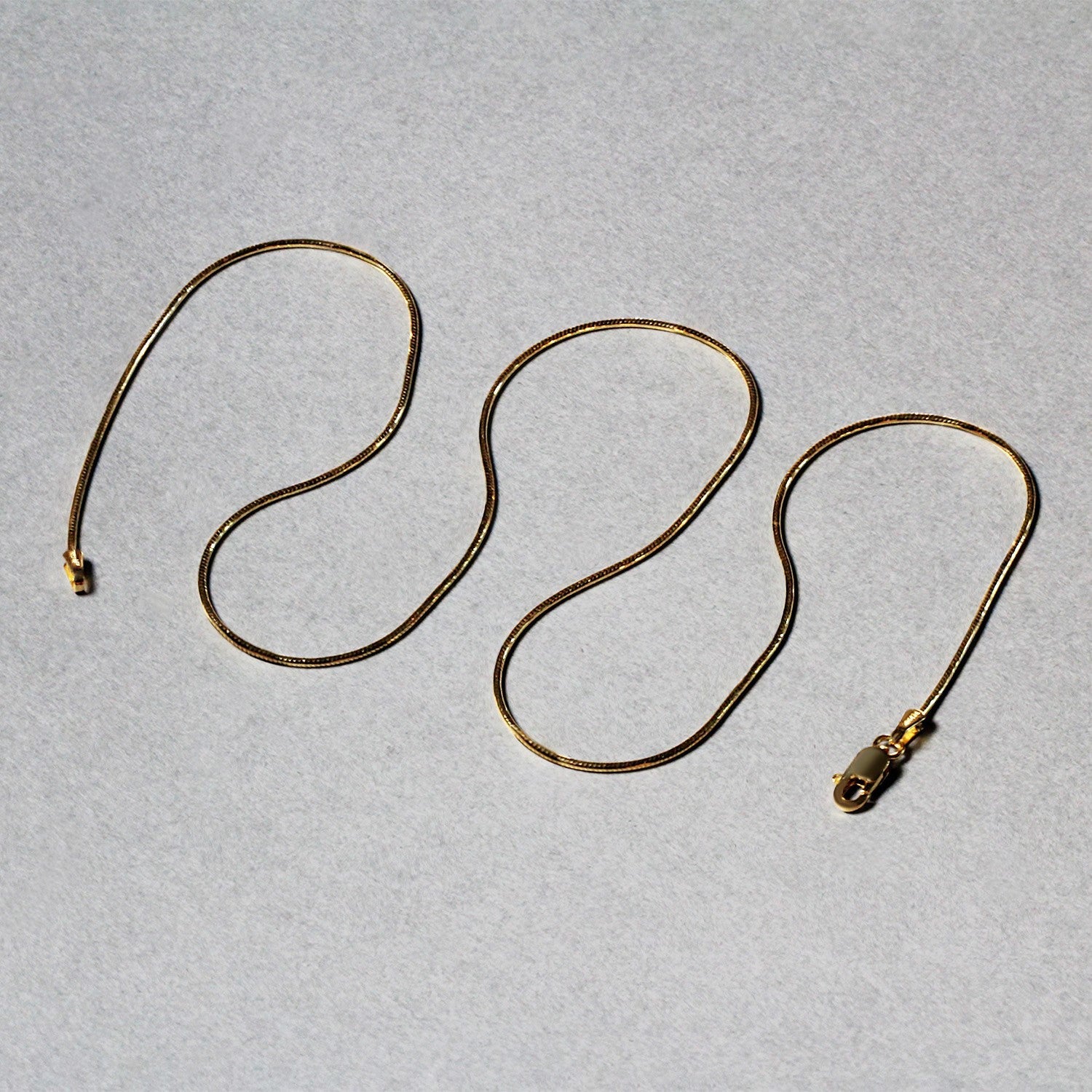 14k Yellow Gold Round Snake Chain 0.9mm by Bids.com