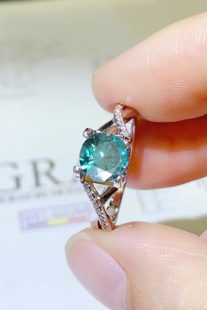 1 Carat Aqua Blue Brilliant Round Cut Sparkala™ Crisscross Platinum Over Pure Sterling Silver Ring - DestGlow