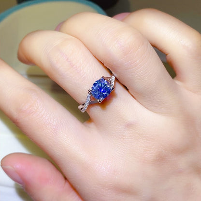 1 Carat Blue Brilliant Round Cut Sparkala™ Crisscross Pure Sterling Silver Ring - DestGlow