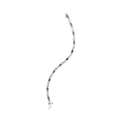 10K White Gold 5x4mm Oval Sapphire Gemstone and 1/10 Cttw Diamond Prong Set "X" Link Bracelet - Size 7" (H-I Color, SI1-SI2 Clarity) by Bids.com