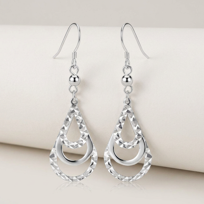 Sterling Silver Textured Graduated Open Teardrop Dangling Style Earrings